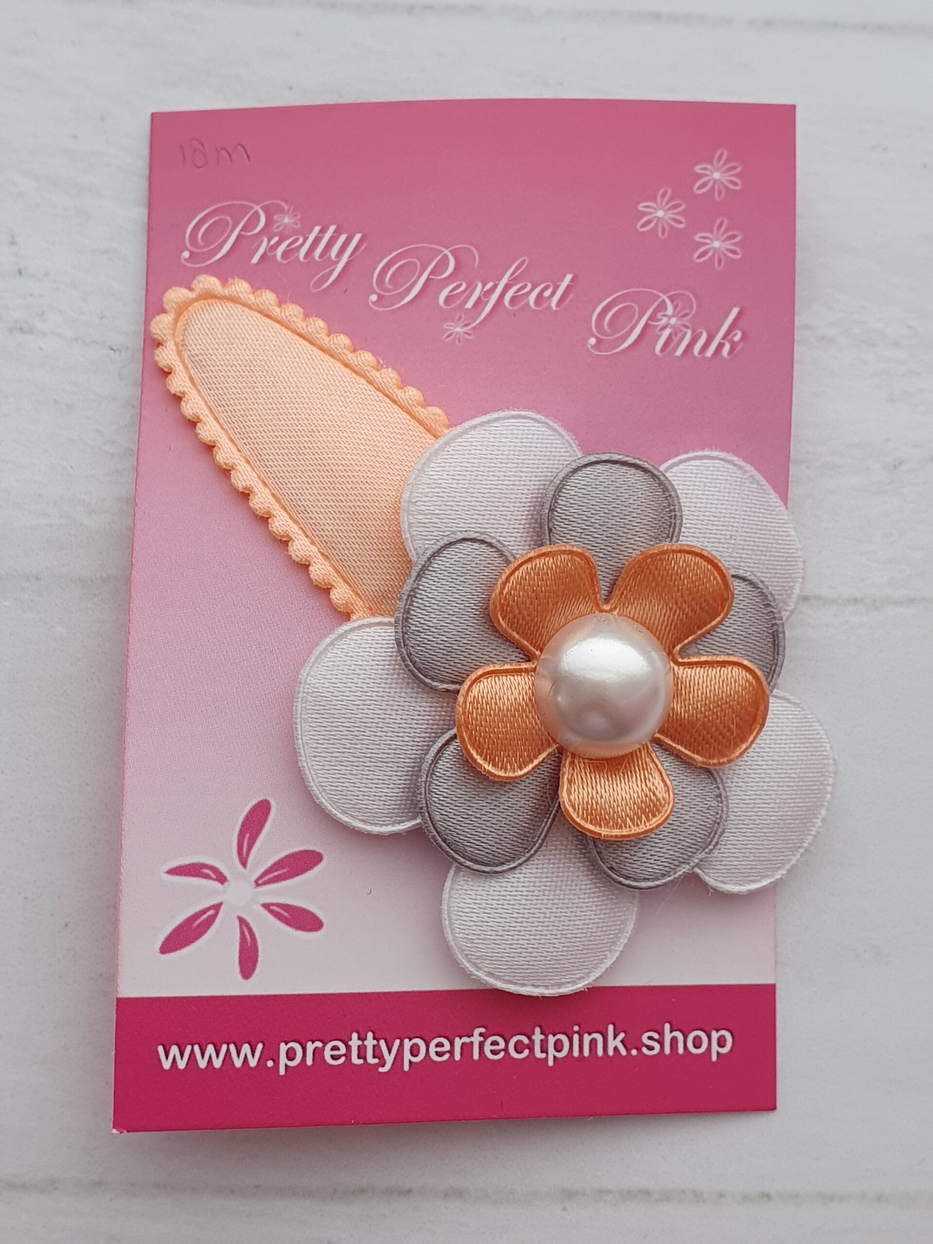 Peach haarspeld met bloem