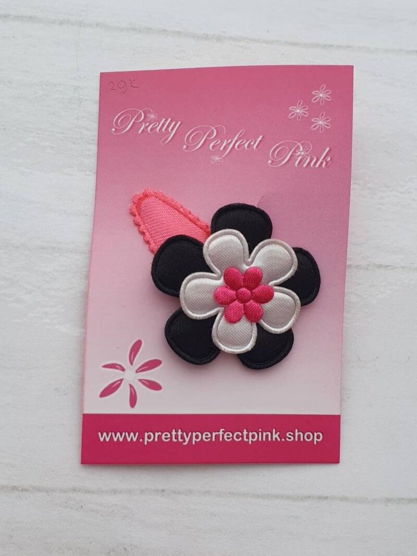 Neon roze haarspeldje met bloemetjes