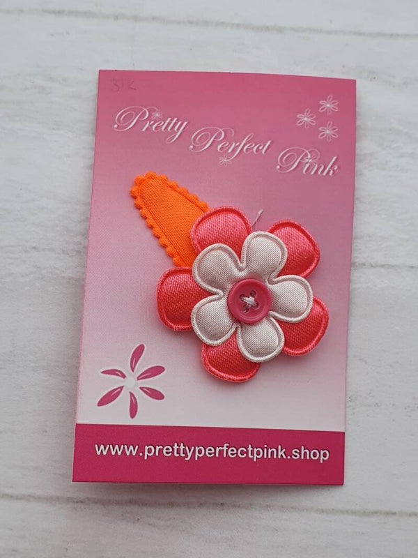 Neon oranje haarspeldje met bloemetjes