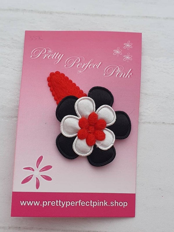 Rood haarspeldje met bloemetjes