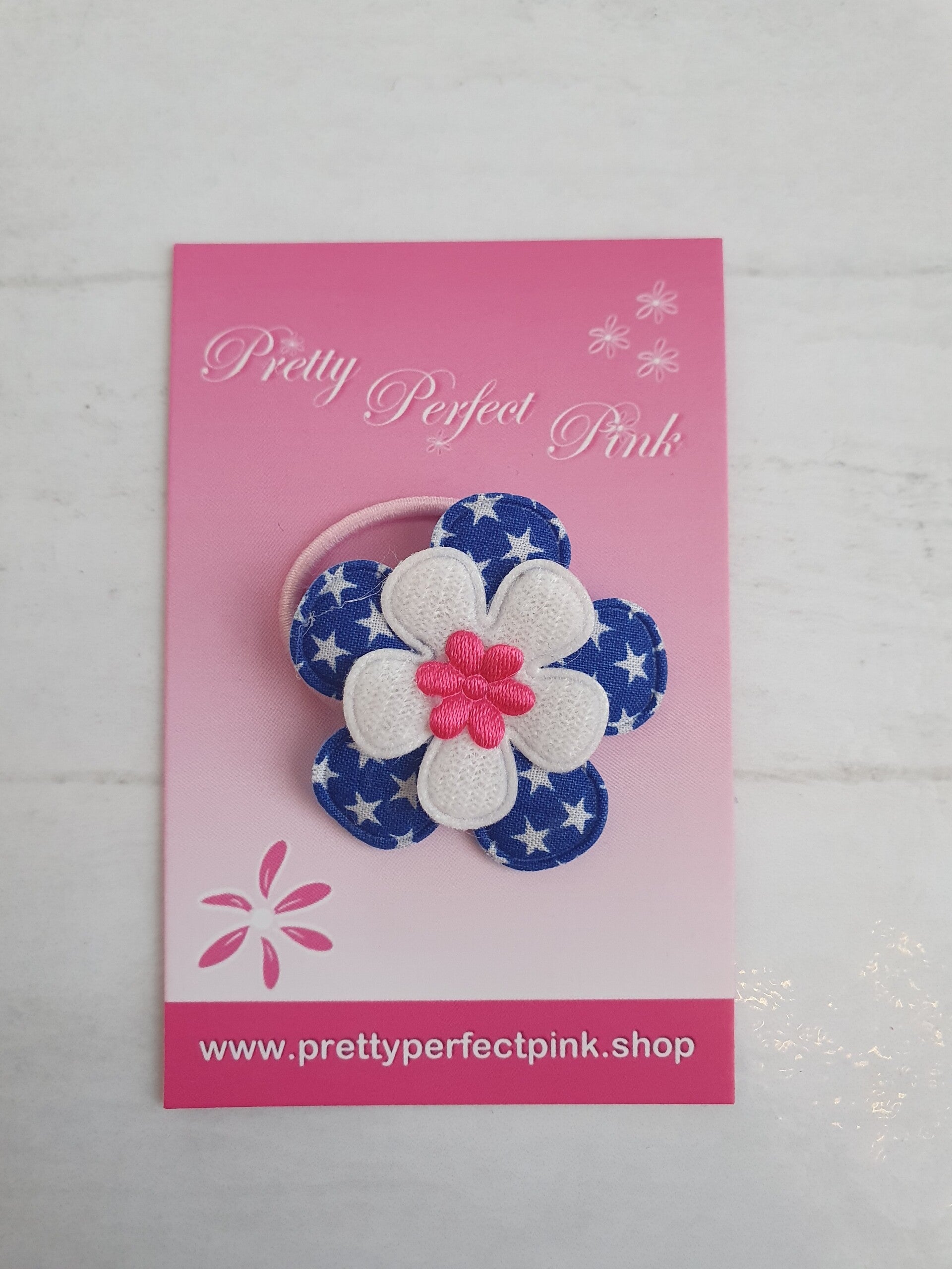 Roze elastiekje met bloemetje