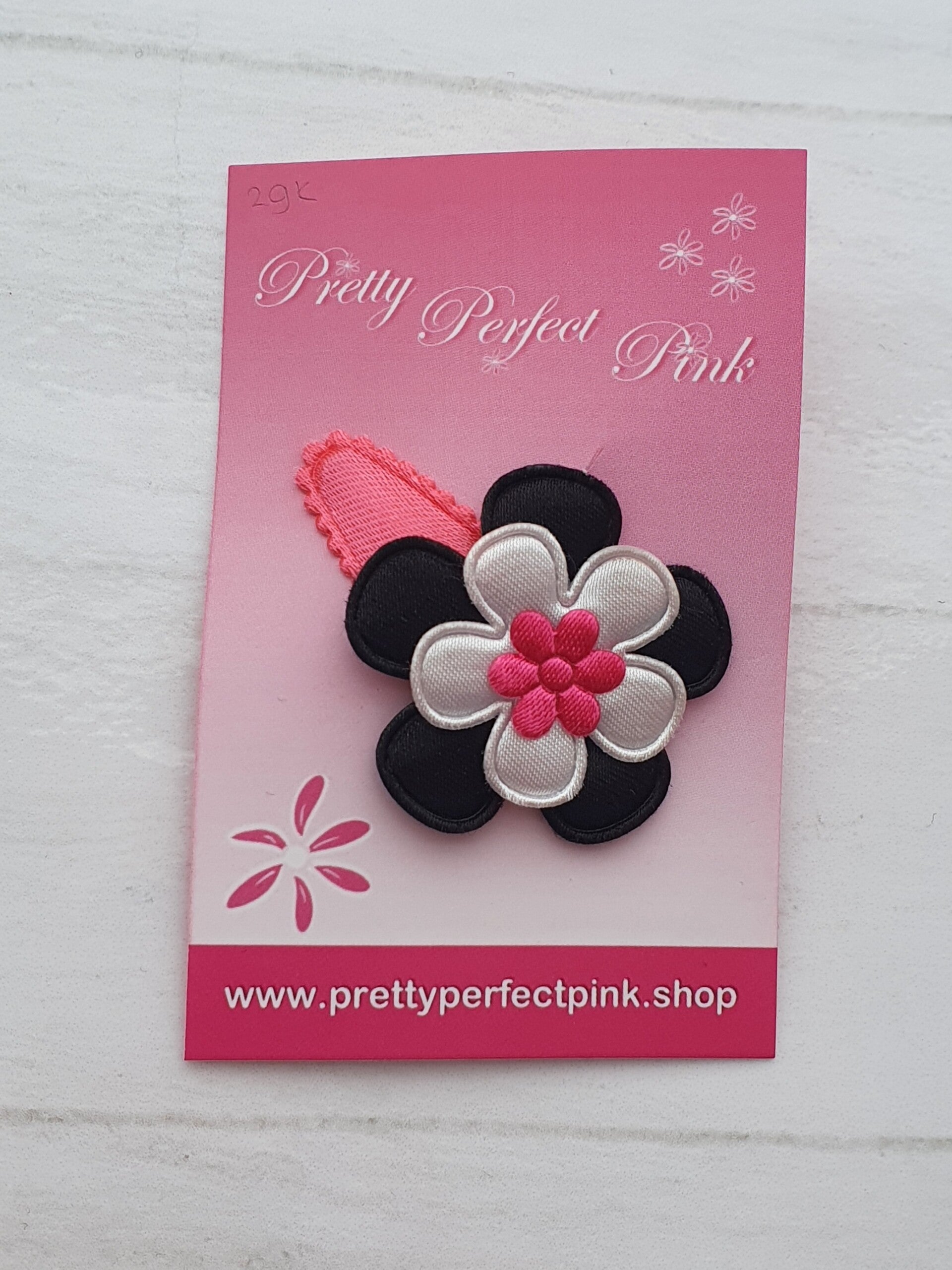 Neon roze haarspeldje met bloemetjes