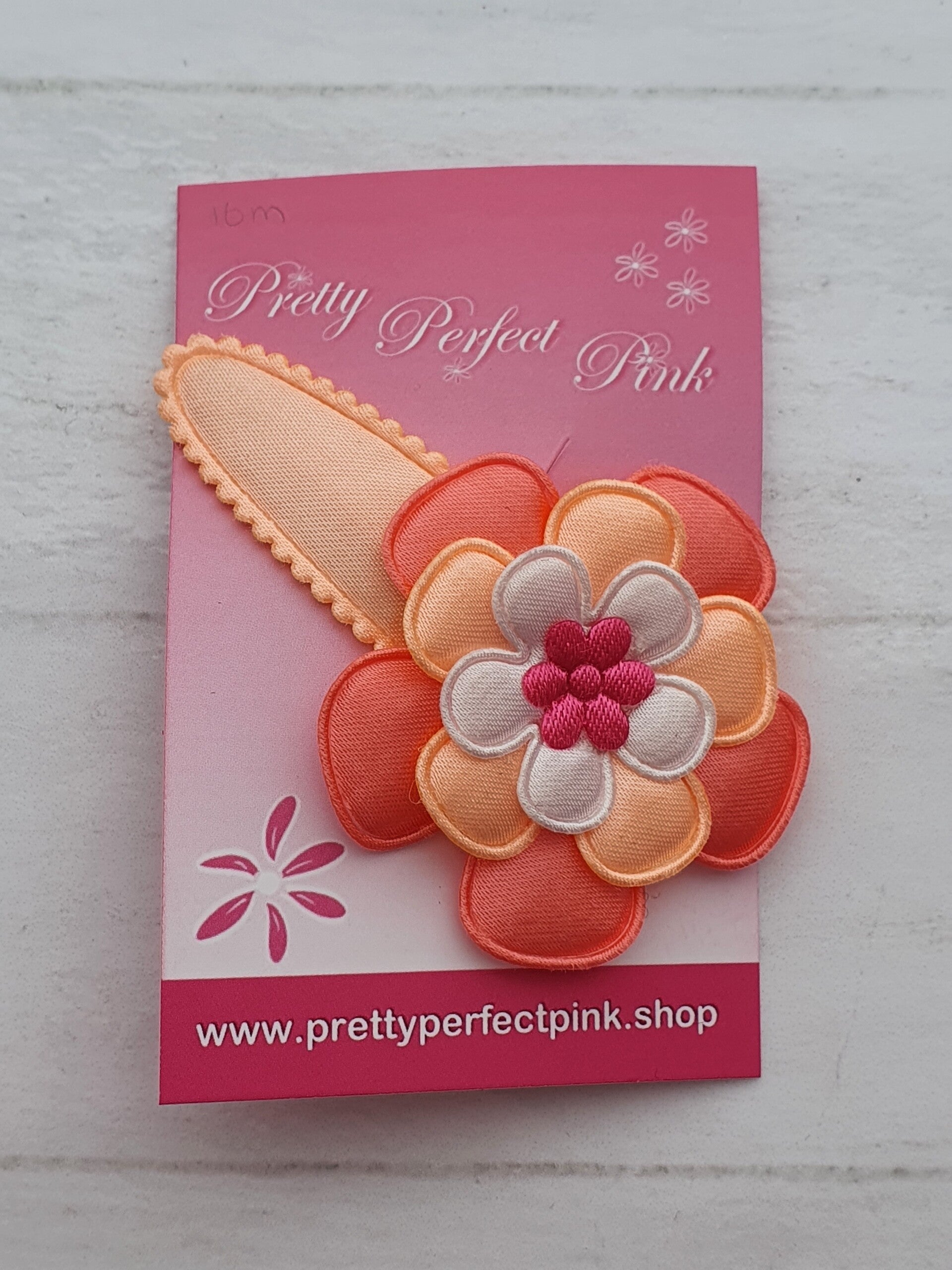 Peach haarspeld met bloem