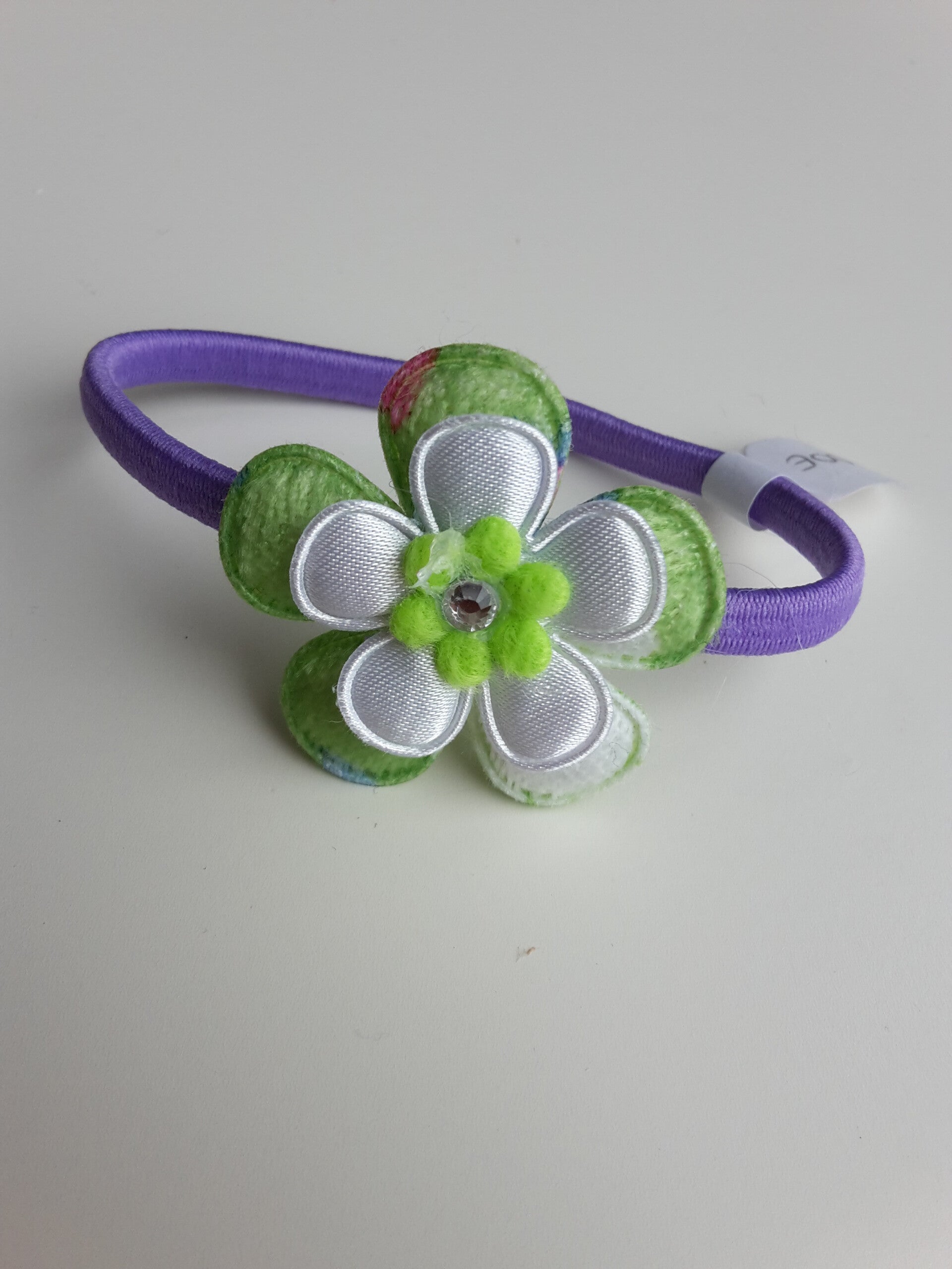 Paars elastiek met bloem