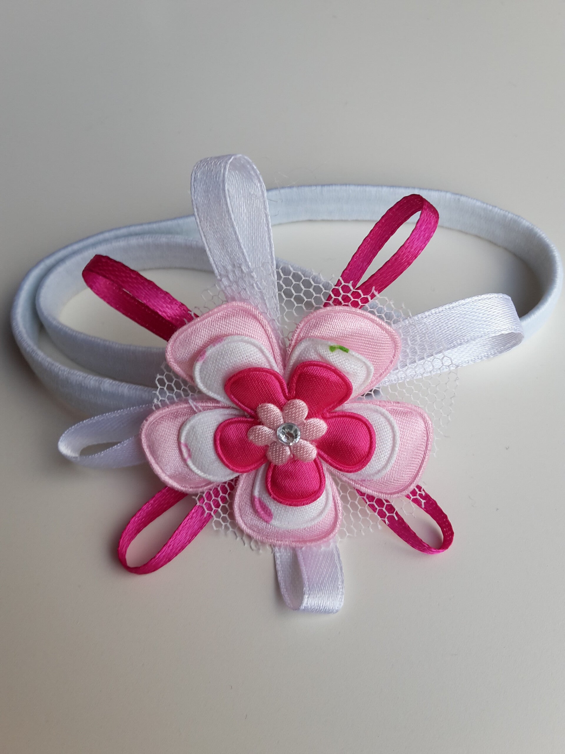 Elastieken haarband met bloem