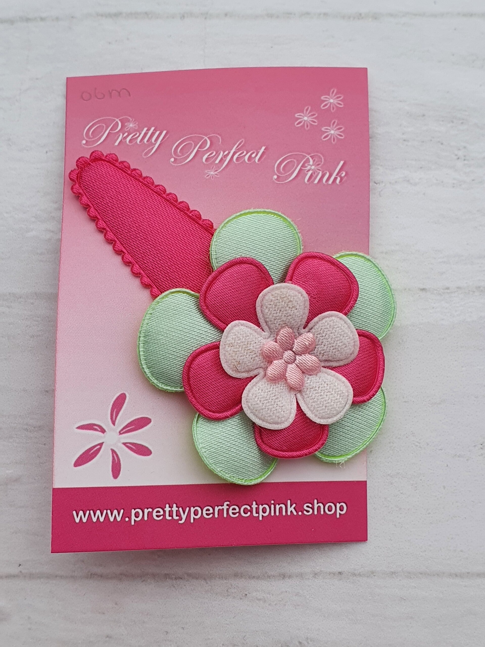 Roze haarspeld met bloem