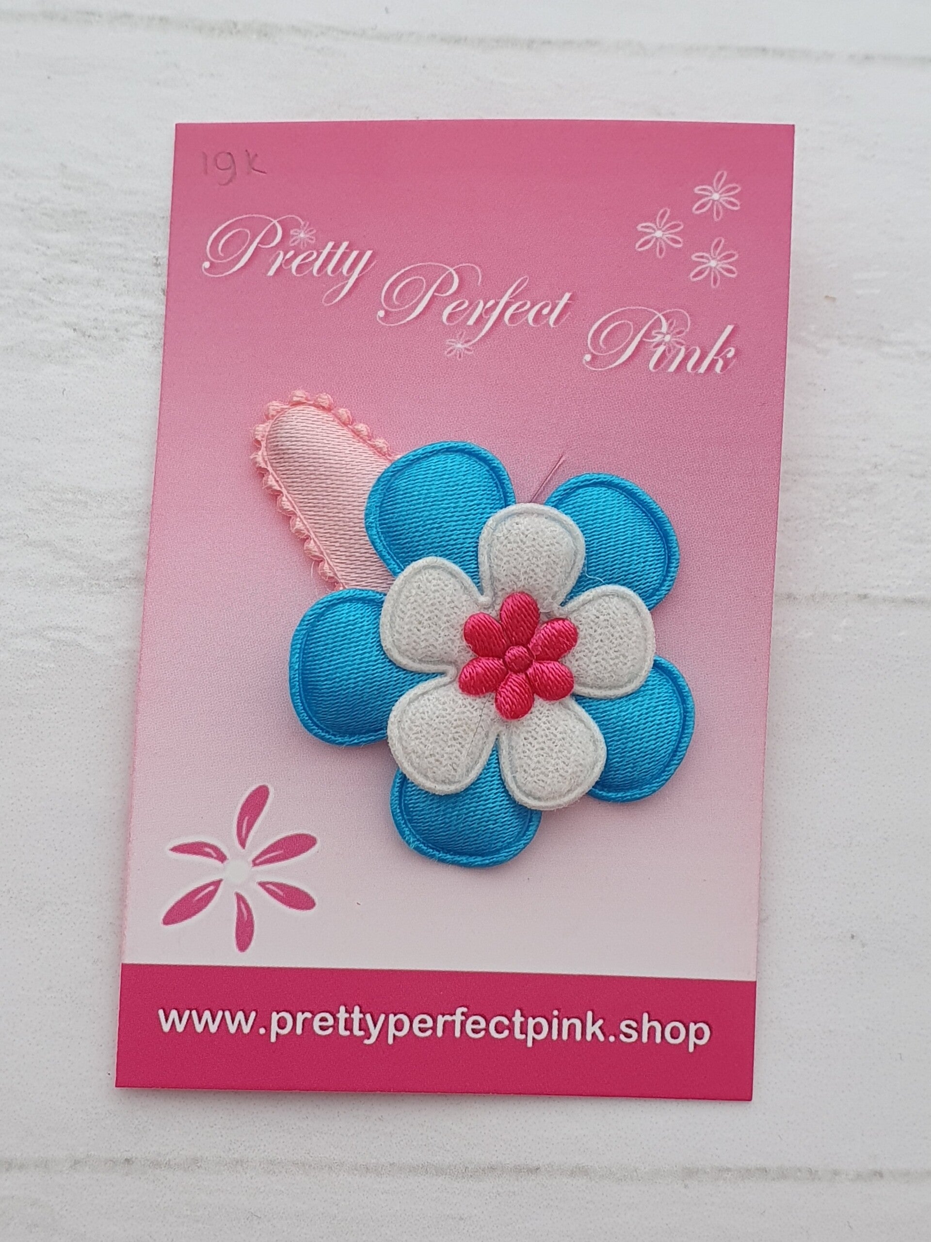 Roze haarspeldje met bloemetjes