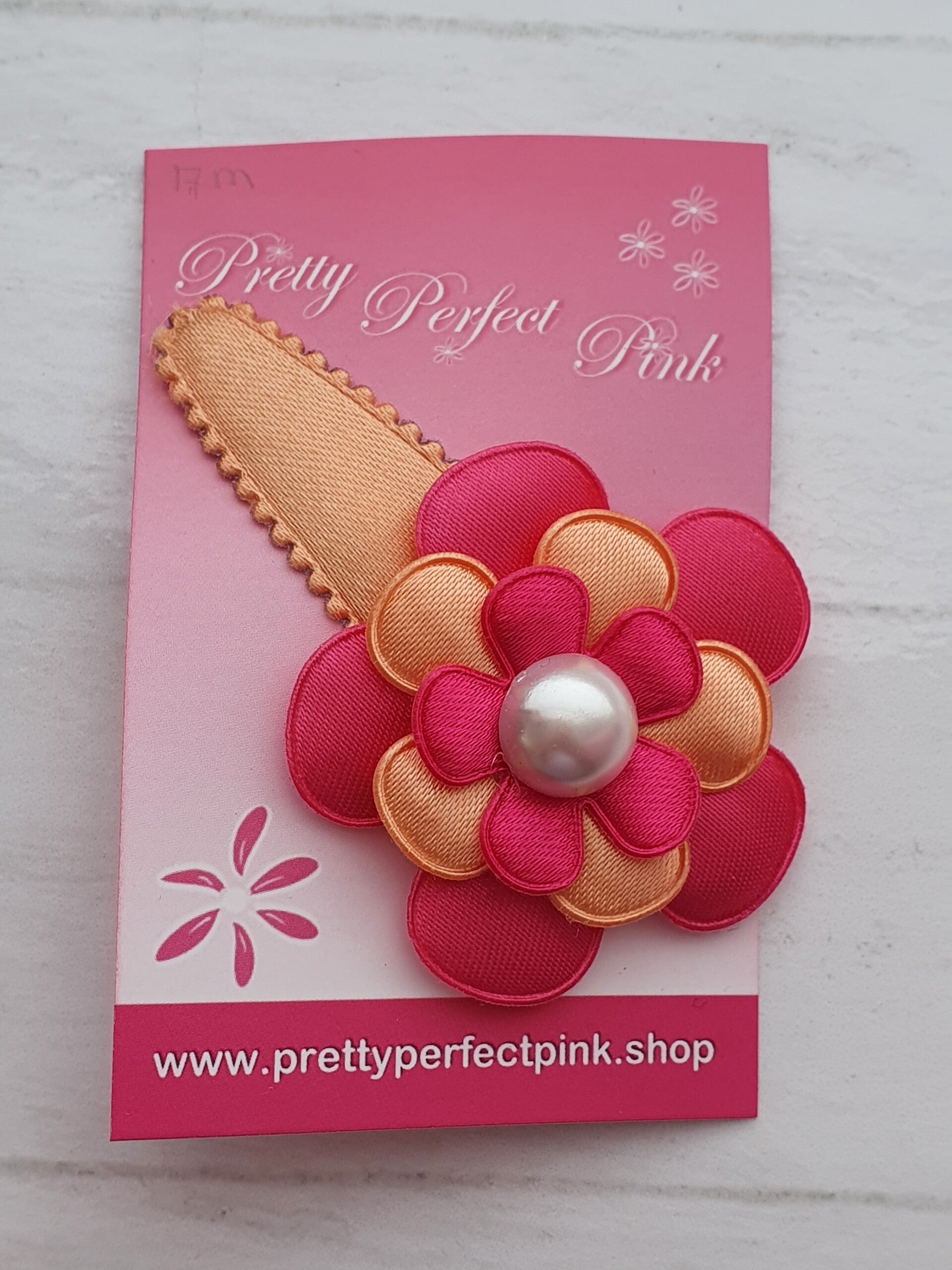 Peach haarspeld met bloem