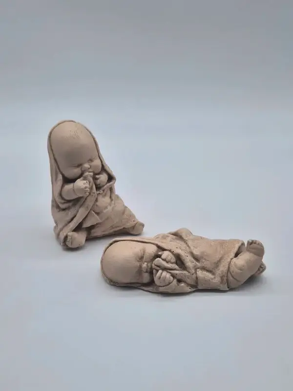 Beeldjes van slapende baby's