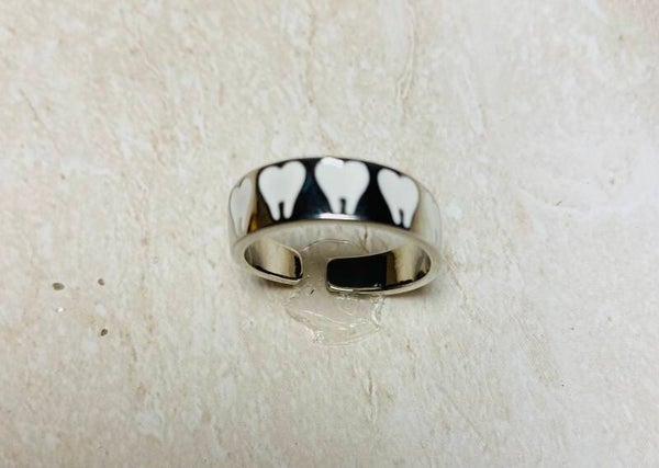 Silver adjustable ring with 6 carved molars around the band