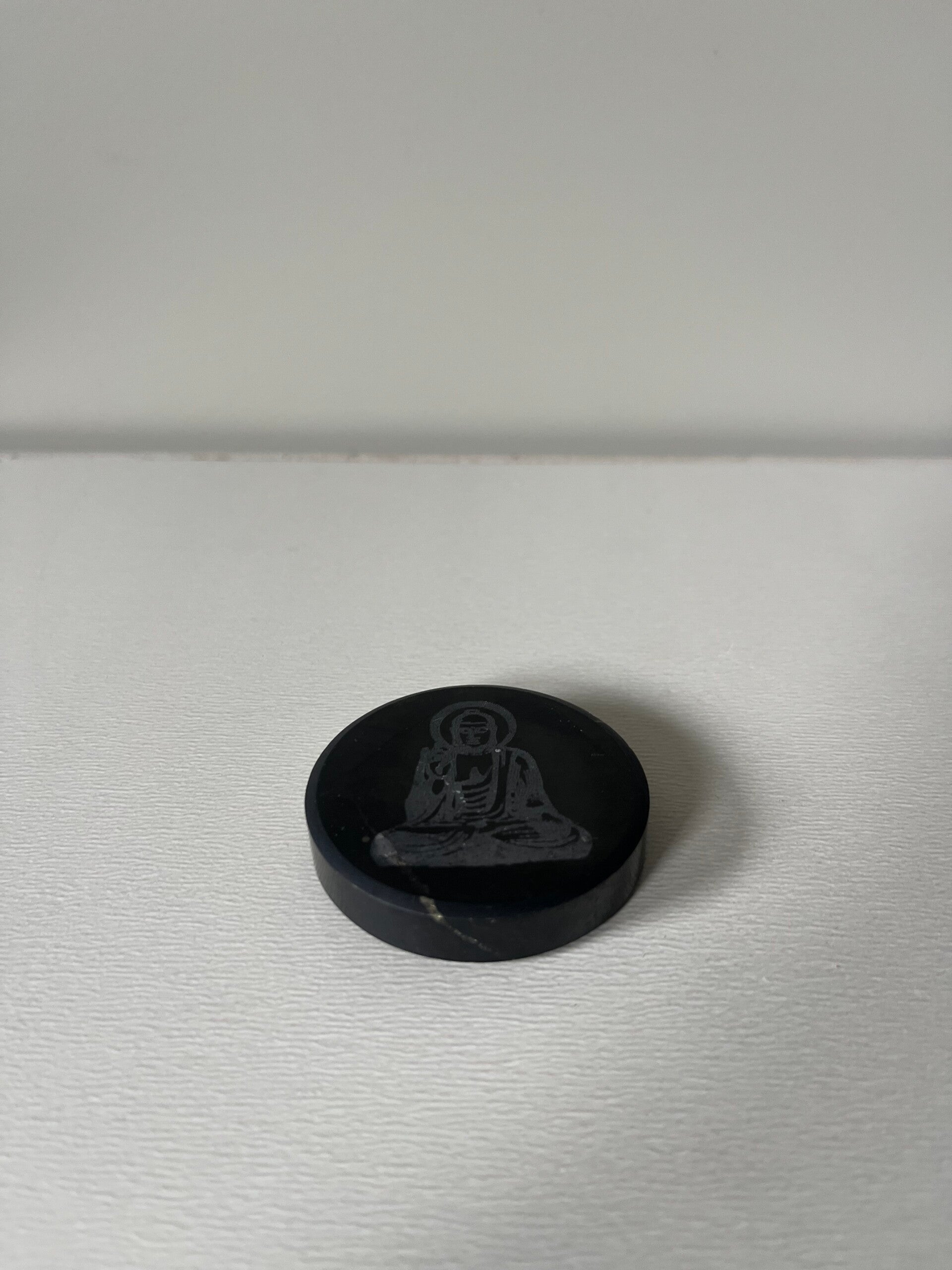 Ronde zwarte Shungiet schijf