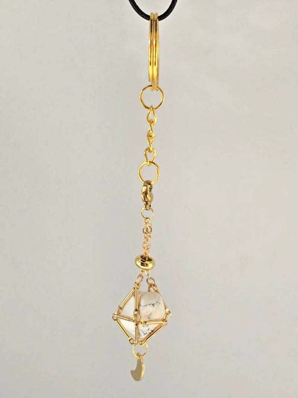 Goudkleurige sleutelhanger met Howliet en maan