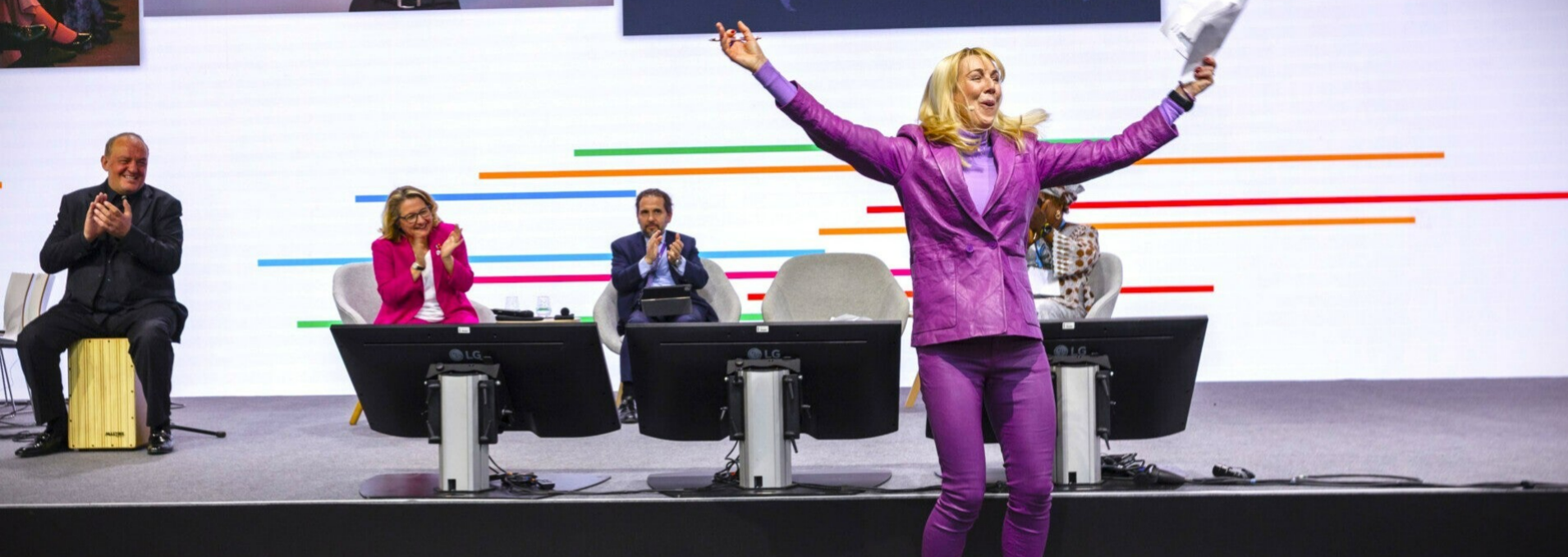 photo of the GDS event, with host celebrating, and audience clapping