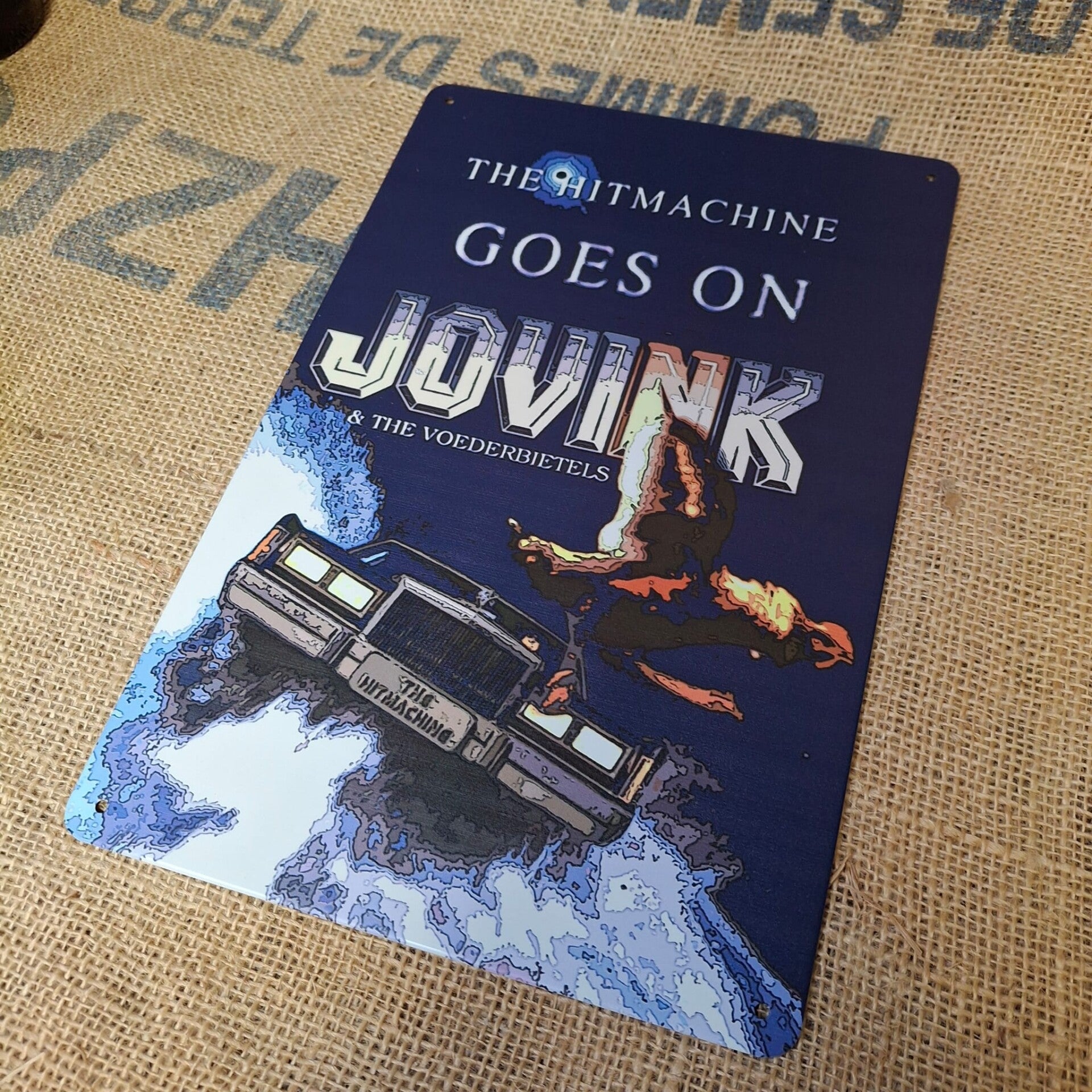 Jovink The hitmachine goes on! - Metalen wandplaat