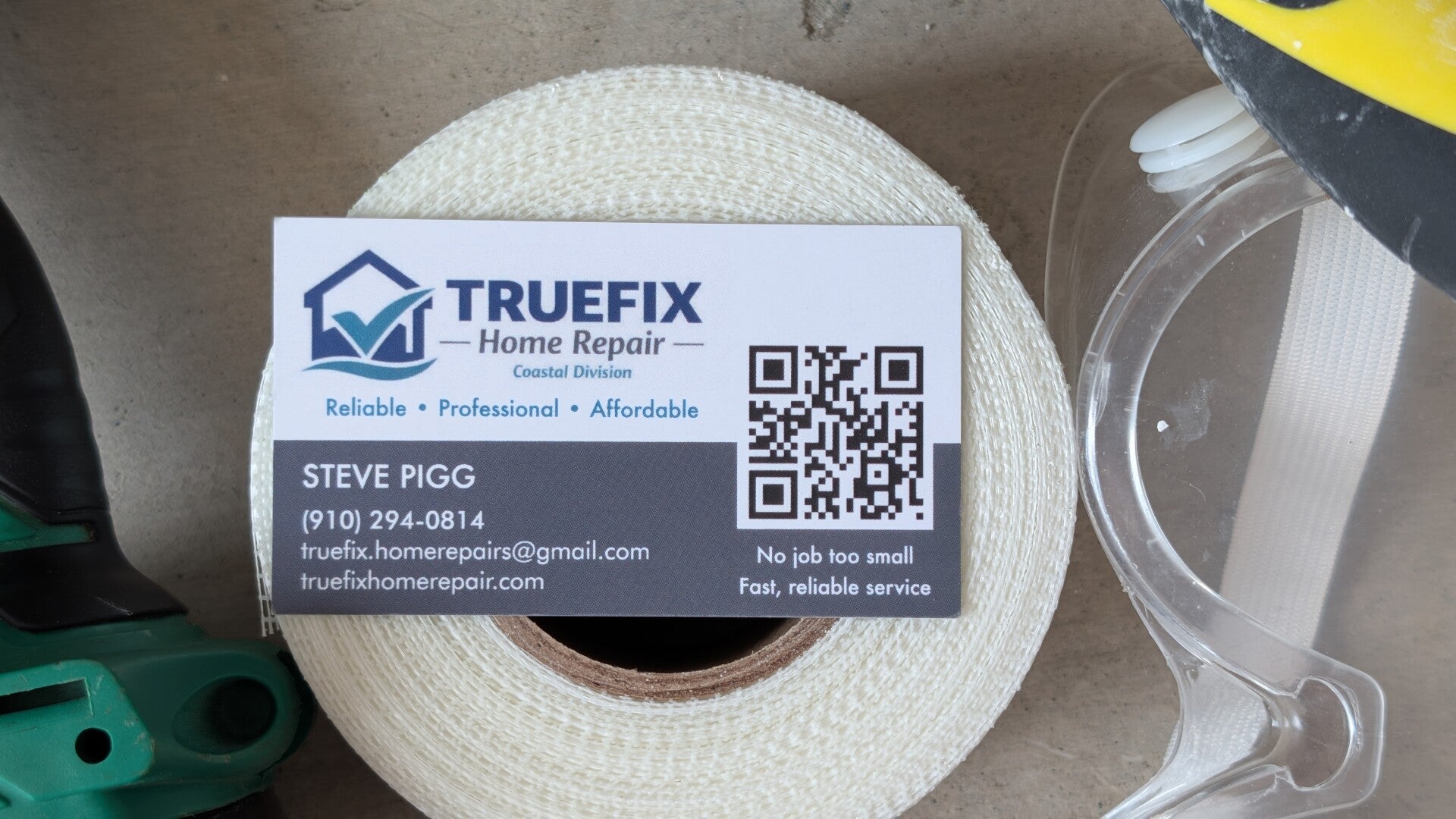 TrueFix Home Repair Card Image sitting atop carpentry tools