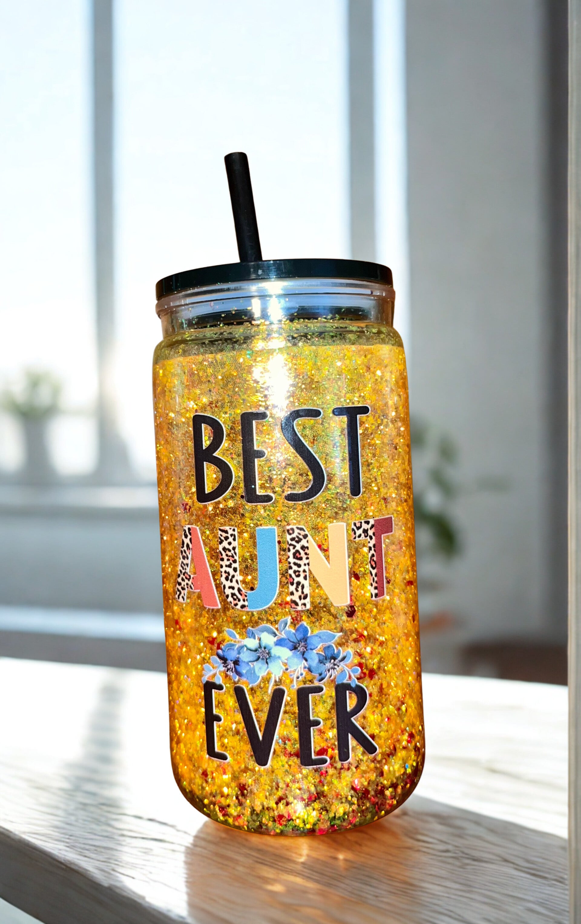 16 ounce Acrylic Snowglobe Tumbler “Best Aunt Ever” in yellow glitter