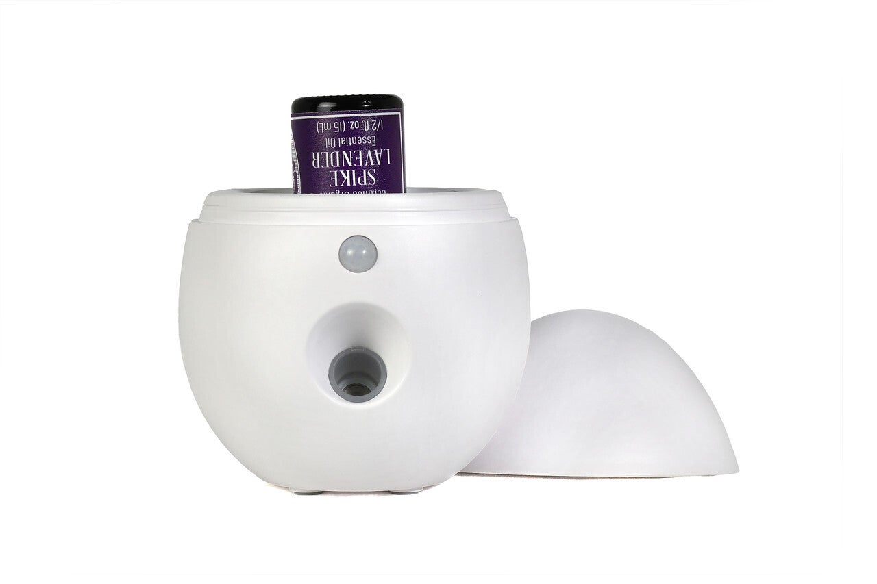 Airburst waterless diffuser releasing soft aroma, creating calm and balance through mindful aromatherapy.