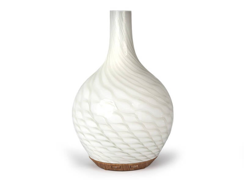 Elegant Maui Ultrasonic Diffuser blending natural wood and glass, creating calm aromatherapy and mindful home energy.