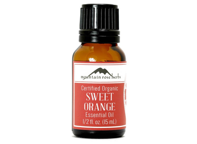 Mountain Rose Herbs Certified Organic Sweet Orange Essential Oil bottle, uplifting citrus scent used in joyful holiday diffuser blends.