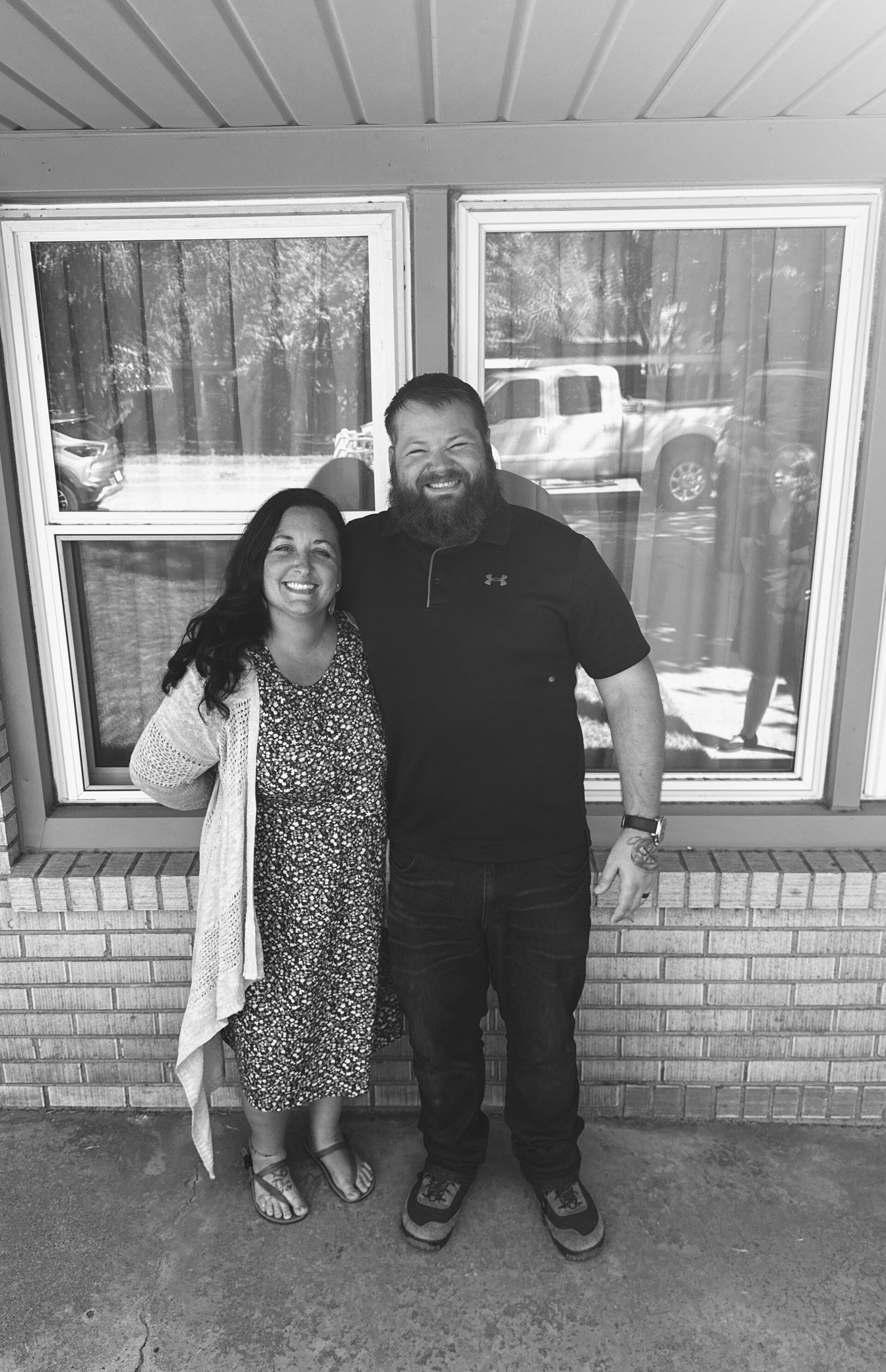 Megan, founder of The Motherhood Calling, Christian doula and childbirth educator, smiling with her husband — offering faith-based virtual doula support, natural birth education, and Christ-centered encouragement for mothers.