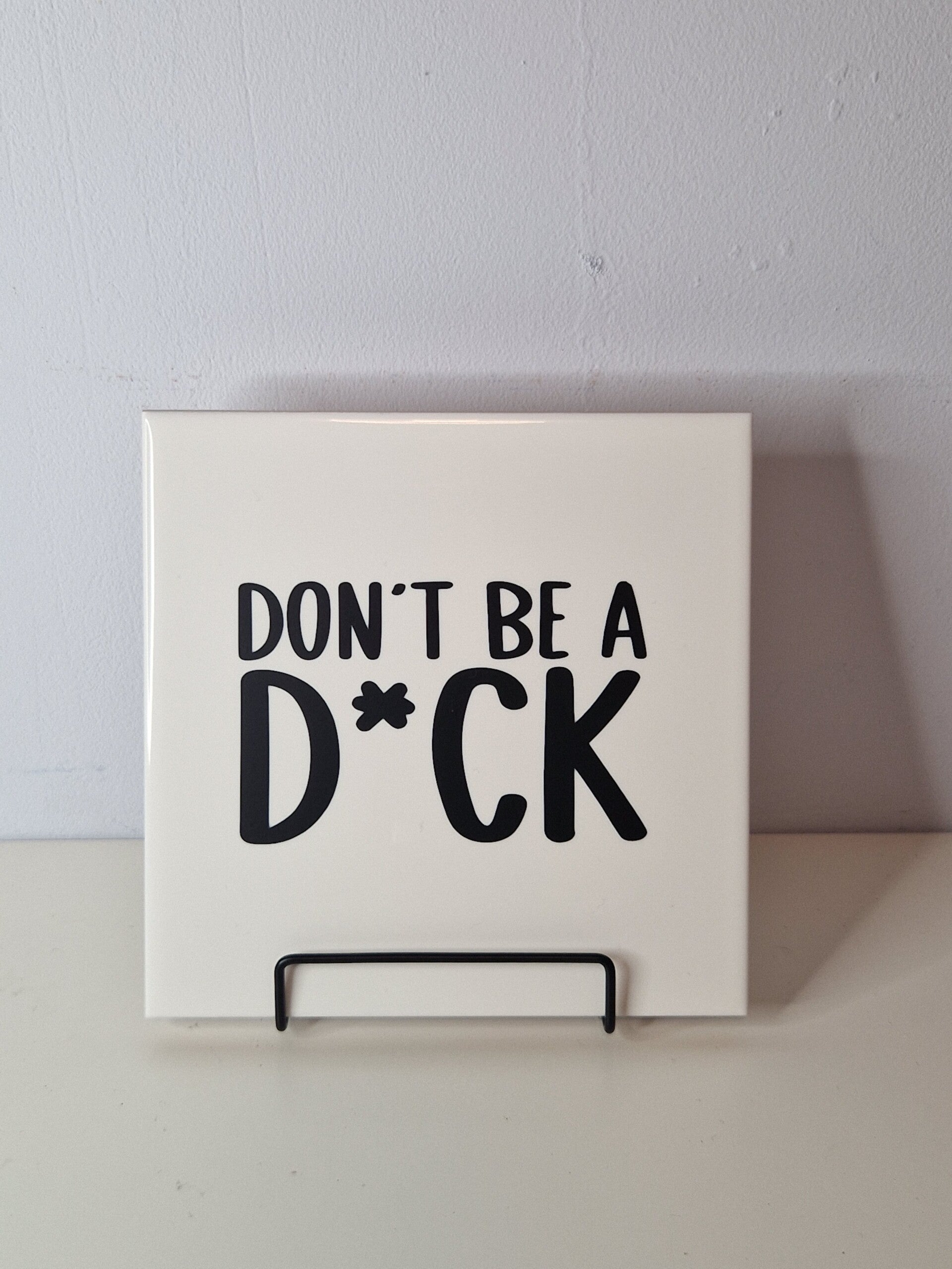 Don't be a d*ck. Tegeltje