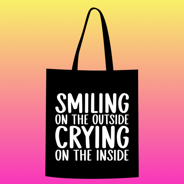 smiling on the outside crying on the inside  Totebag