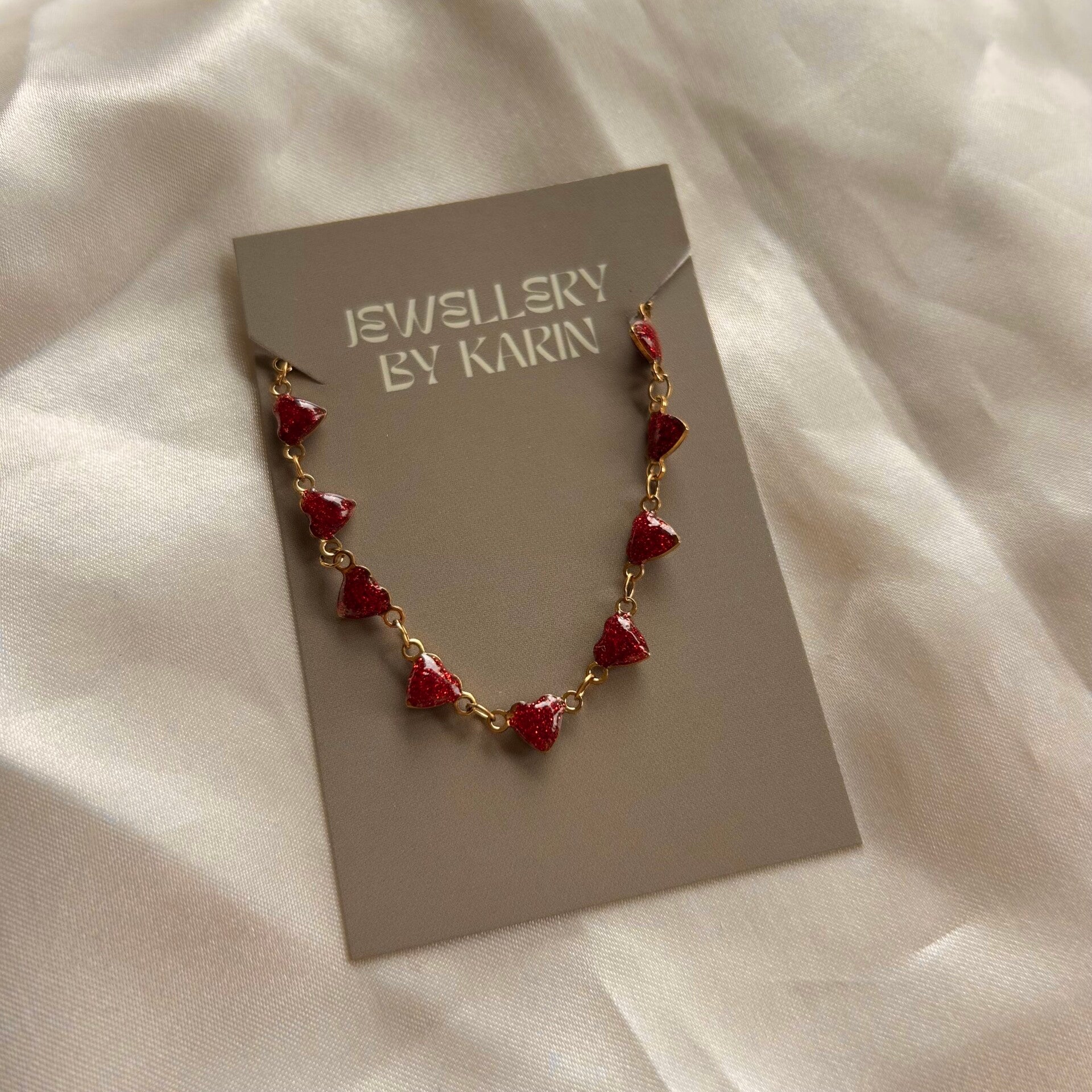 bracelet chained hearts red gold