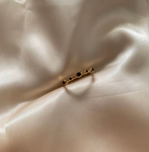 ring row of diamonds dark purple gold