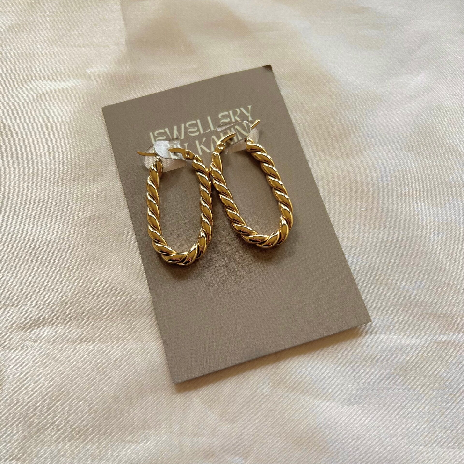 earrings gold oval hoops texture