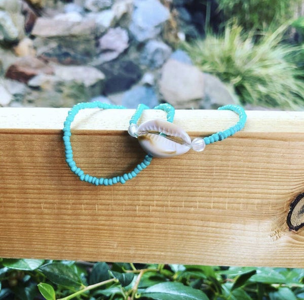 Setje armbanden met schelp 