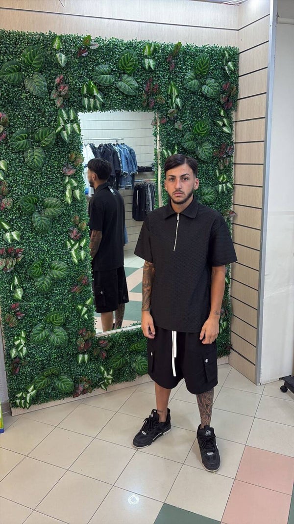 Polo nera con zip