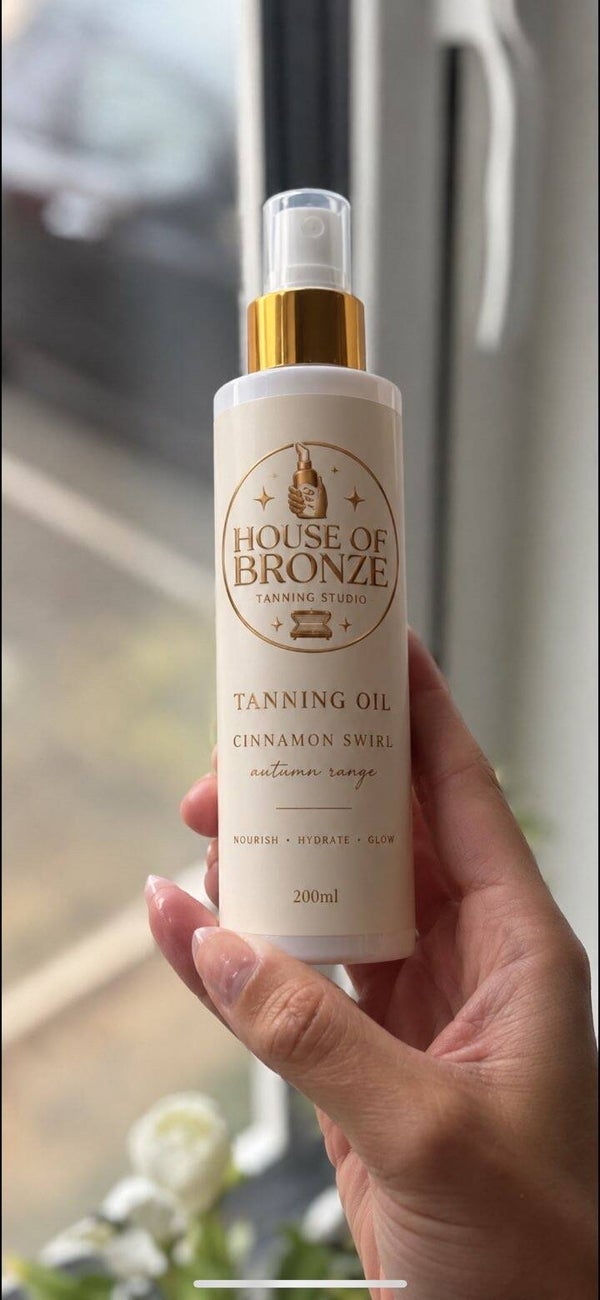 Tanning oil spray