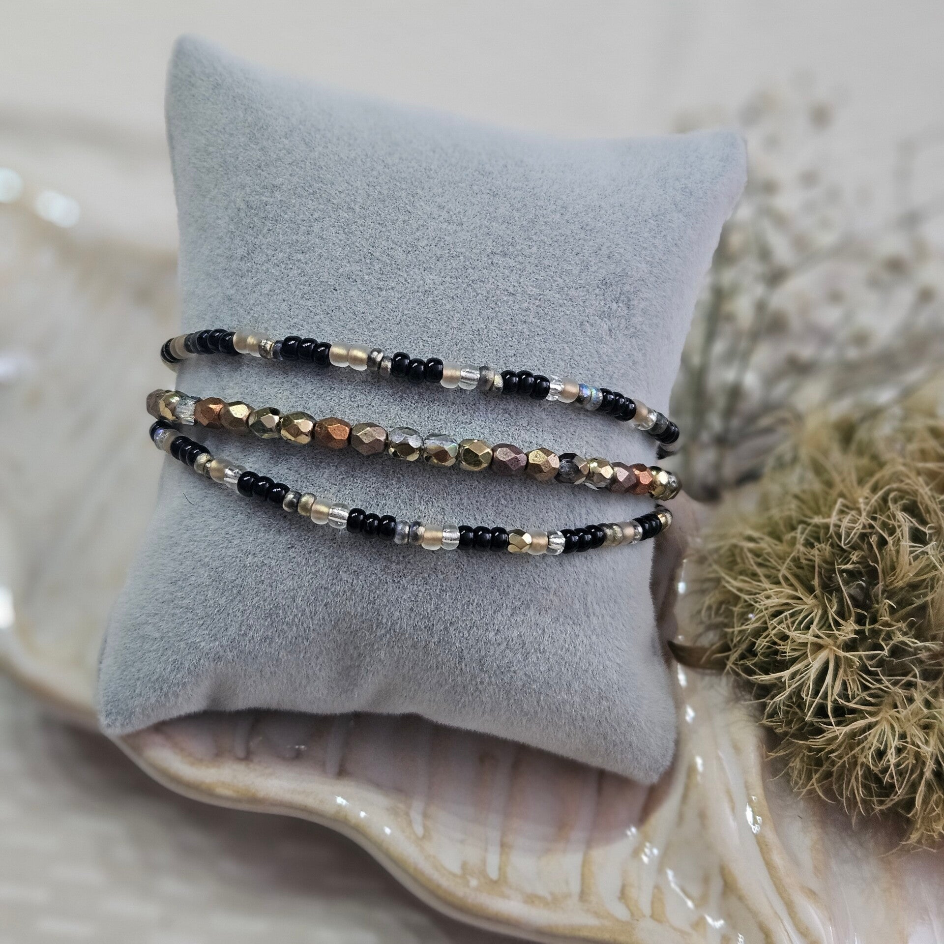 Armband black gold trippel