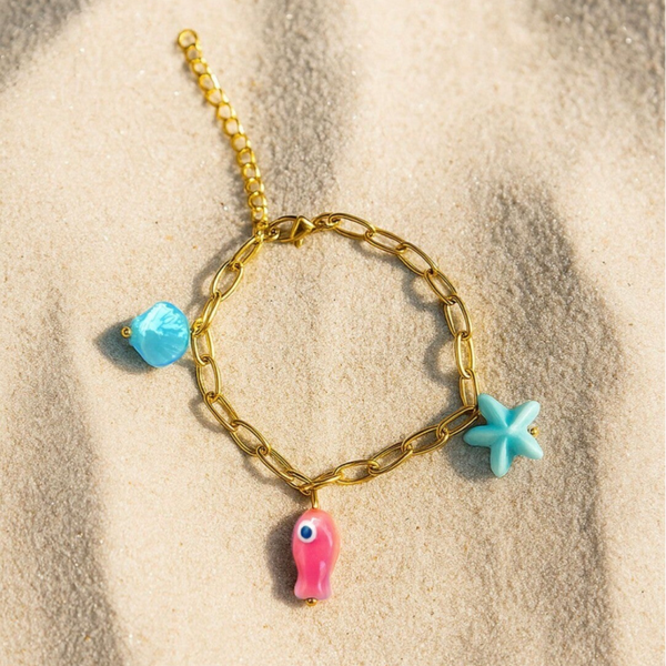 Pink fish armband goud