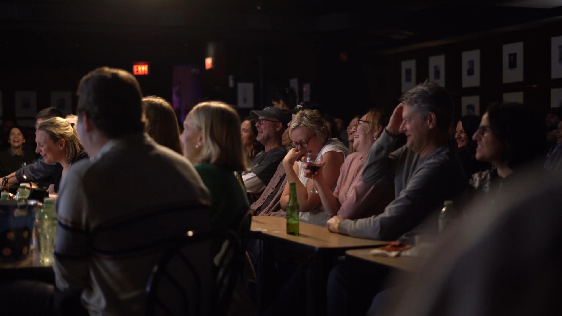 stand-up comedian performing for a group