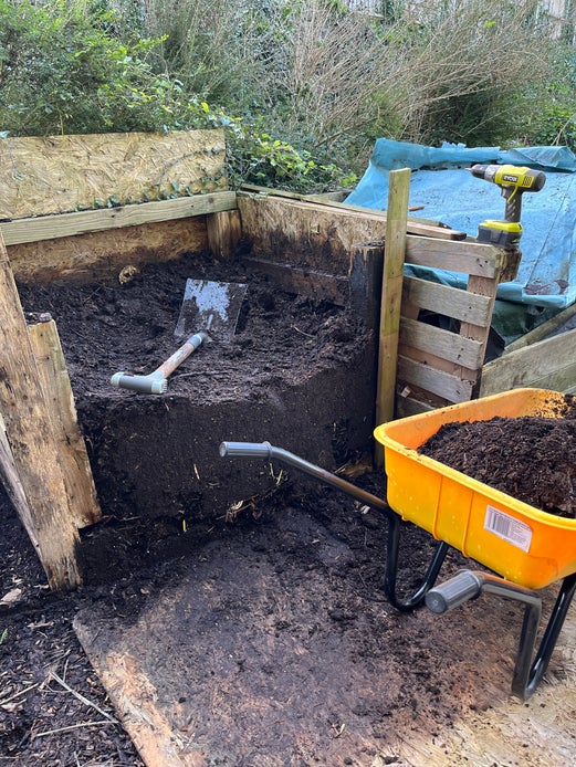 Matured compost heap being emptied