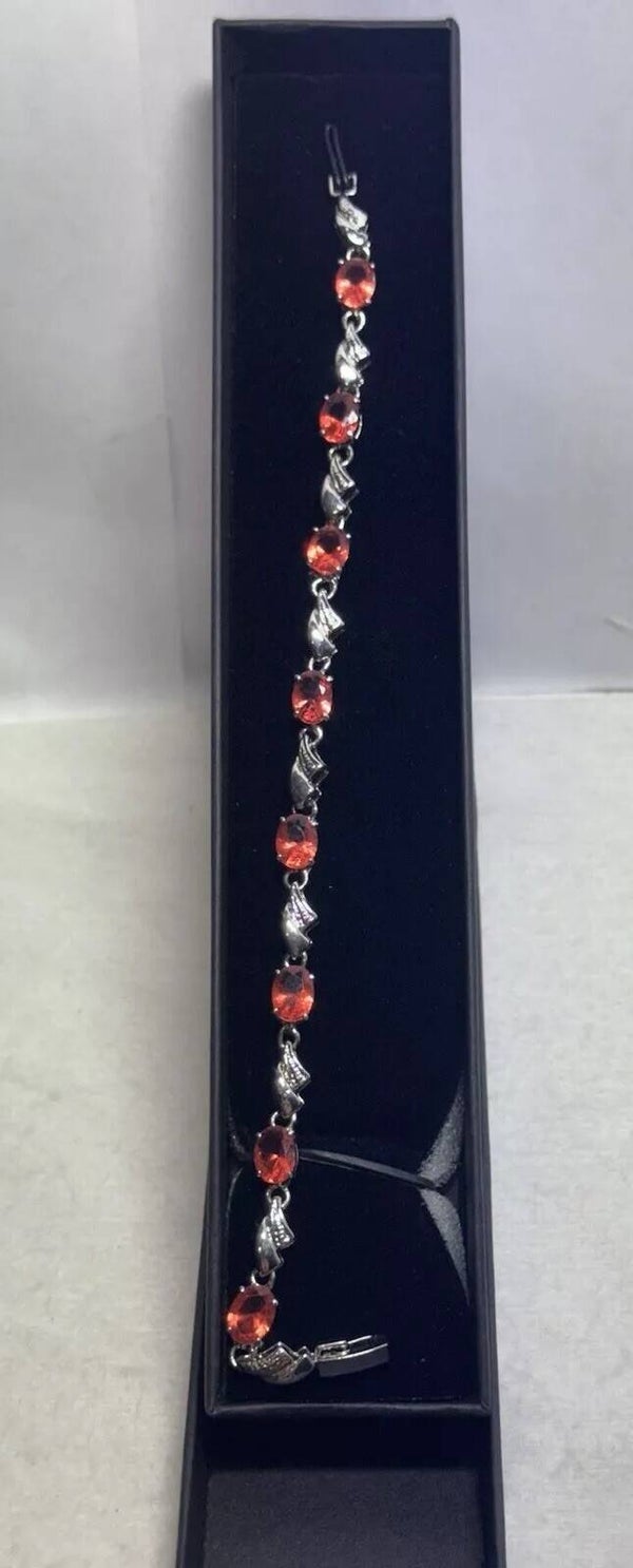 Ladies Silver Coloured Braclet With Pinky Peach Coloured Stones In Box