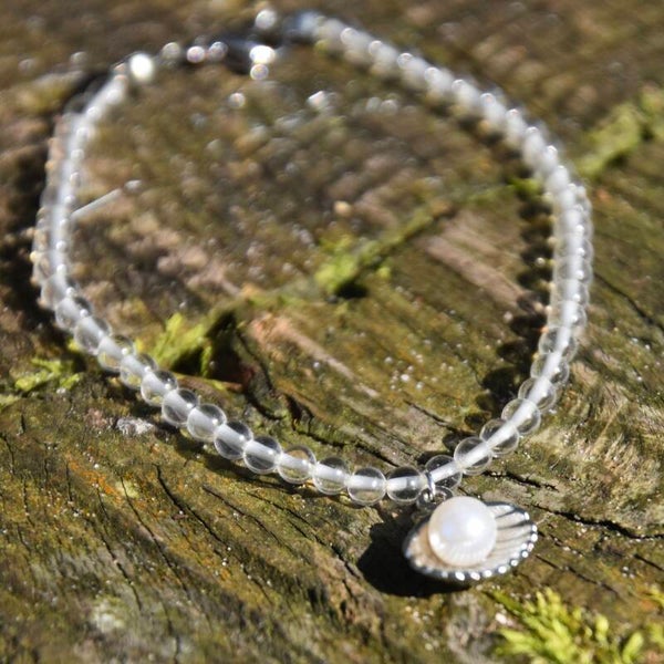 Bergkristal kralenarmband met schelp