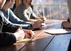 Coworkers sitting at a table for a meeting