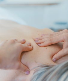hands providing a thai massage