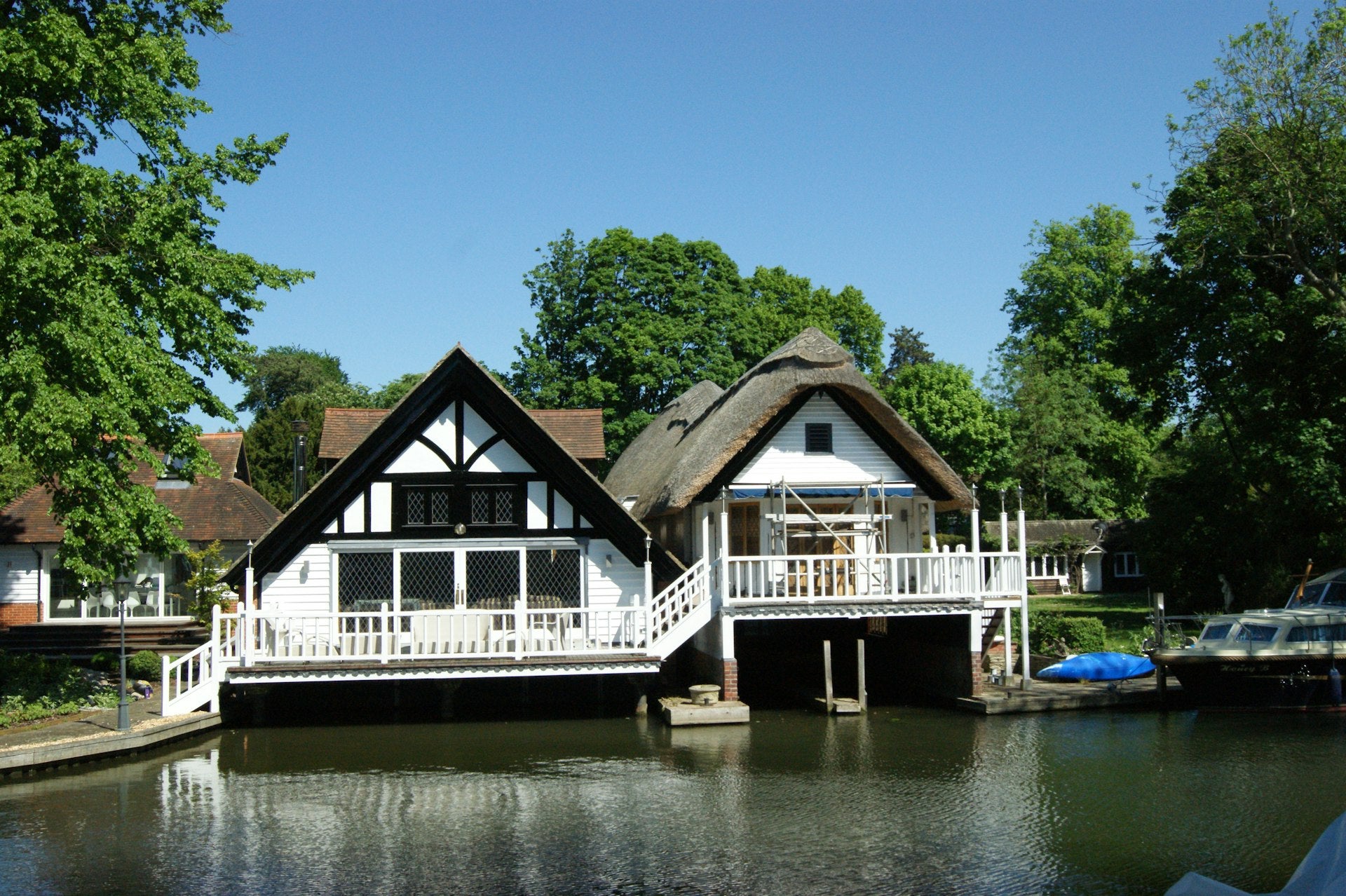 Riverside thatched cottage and boathouse — discreet home care.