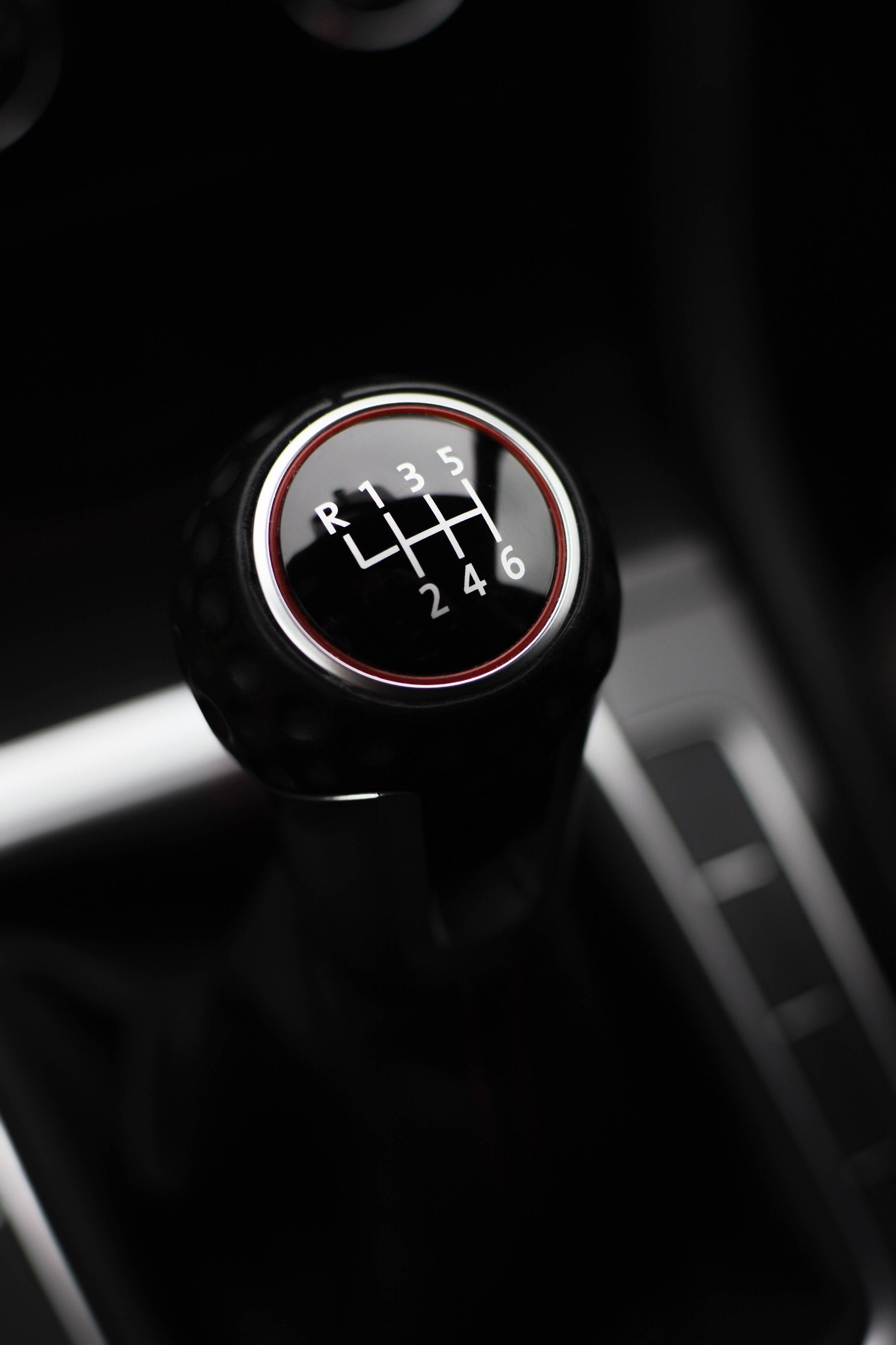 The photo presents a detail of a gear stick to denote the Manual Gear Box
