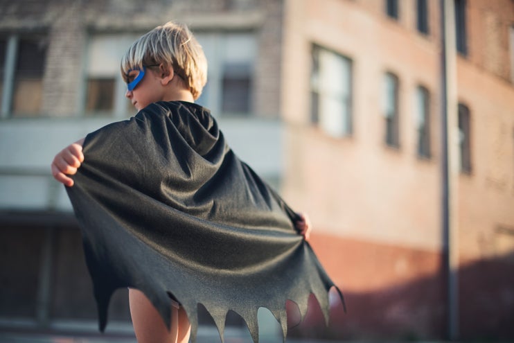 A child wearing a cape